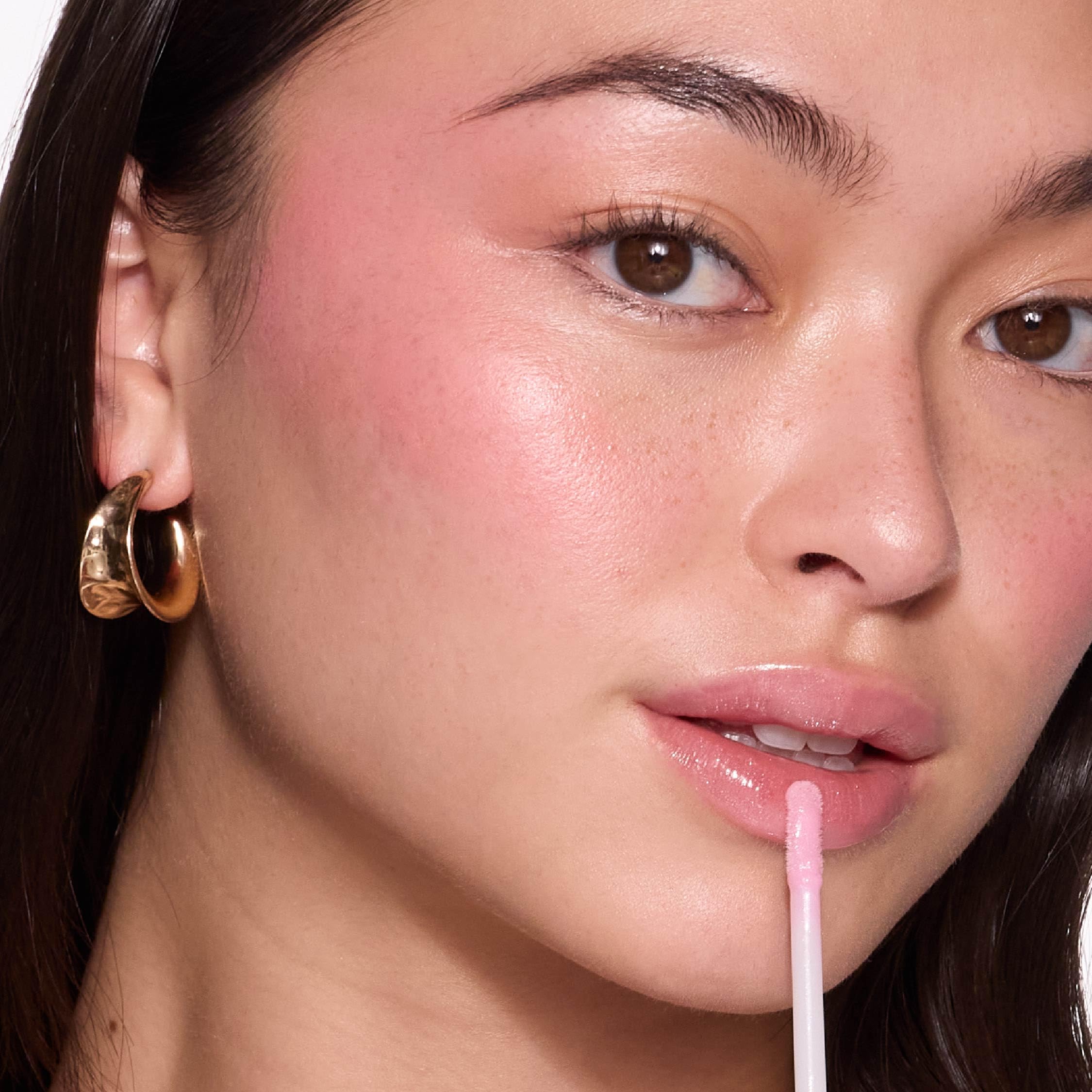 MCoBeauty Lip Lights Shine Gloss with LED mirror for quick touch-ups.