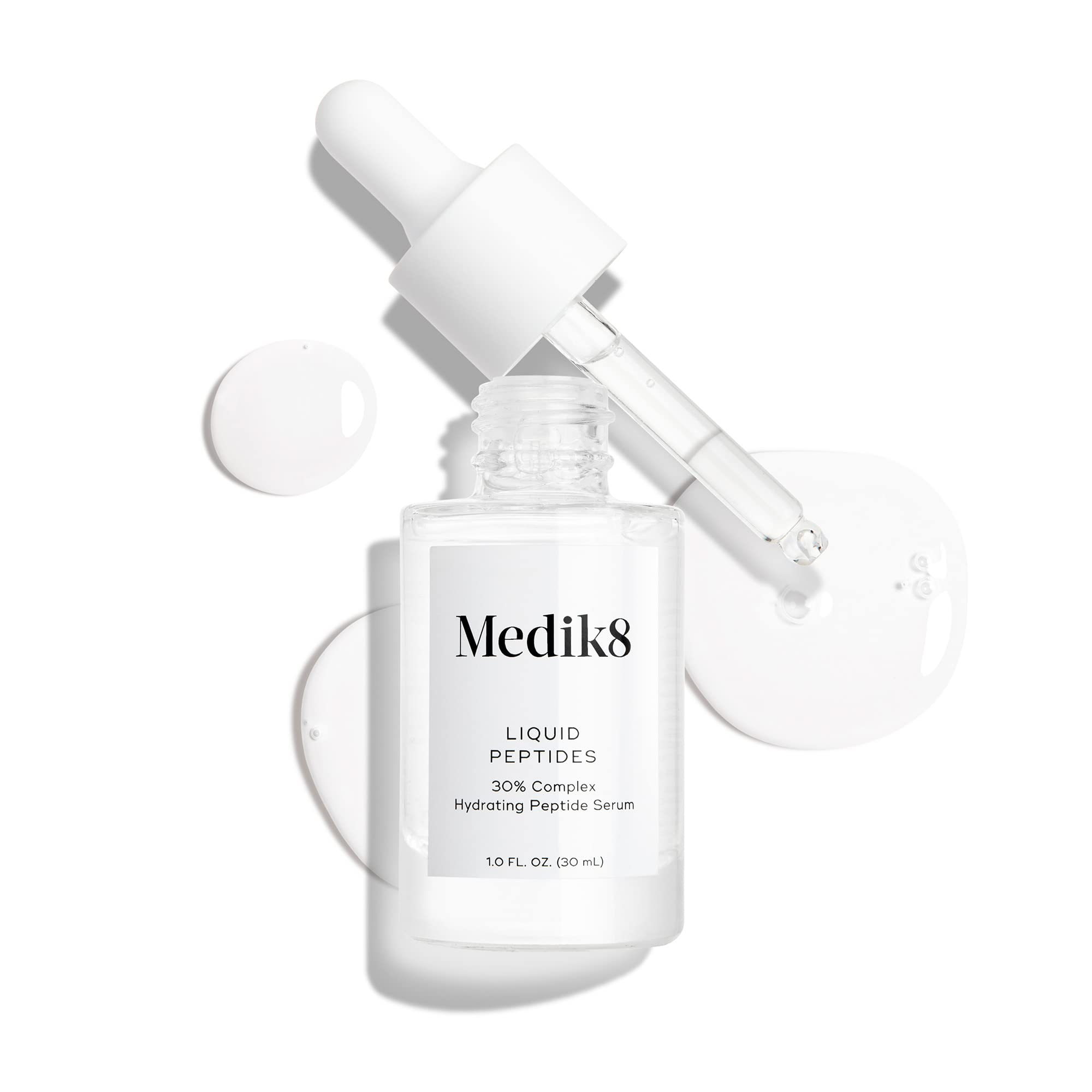 Medik8 Liquid Peptides texture on skin, suggesting smoothing and hydration benefits.