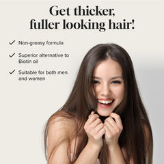 Meraz Pureauty Naturals Biotin Hair Growth Serum dropper application for precise use and control.