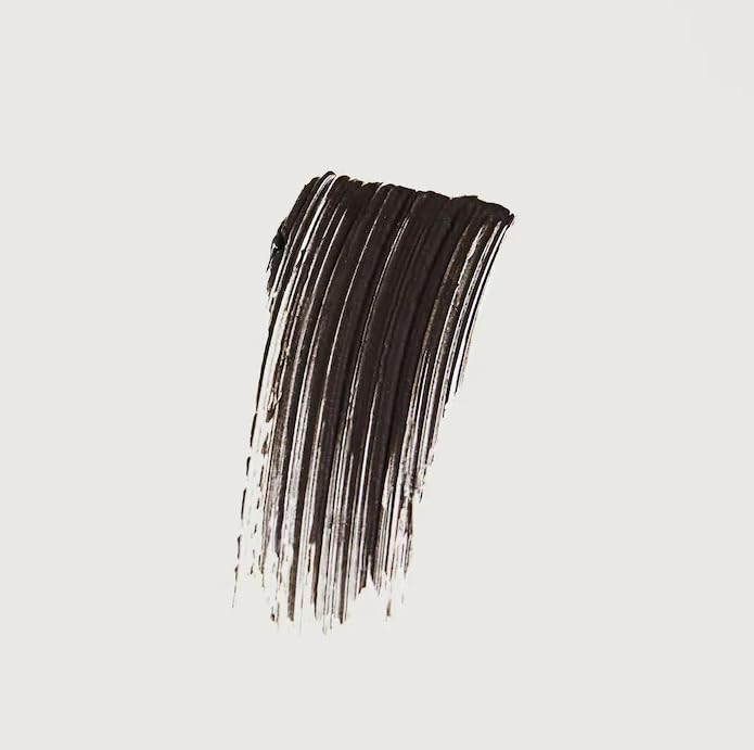Merit Brow 1980 swatches reveal buildable black-brown shade for versatile looks.