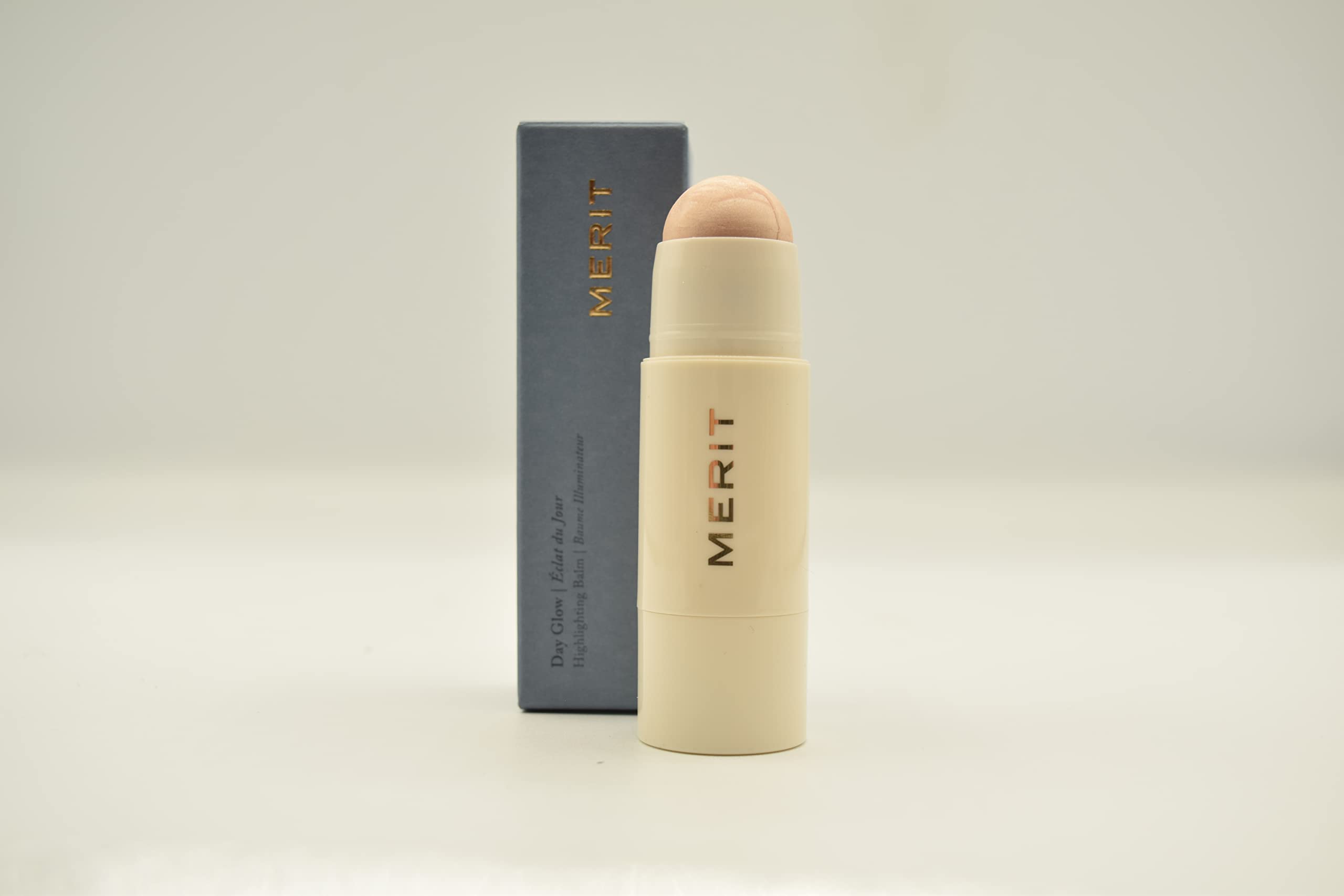 Merit Day Glow Dewy Highlighting Balm Cava swatch on skin for lightweight radiant finish