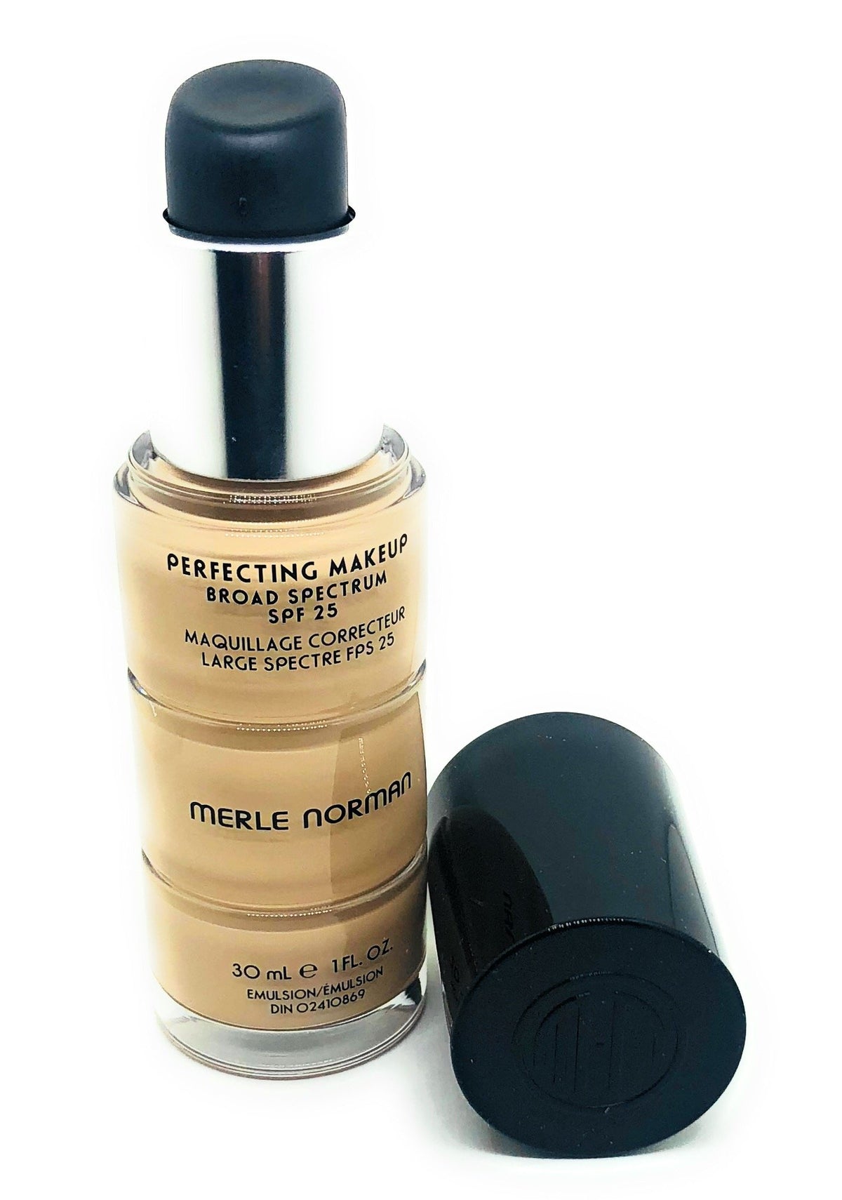 Merle Norman Perfecting Foundation Alabaster Beige bottle pour for a satin, skin-like finish.