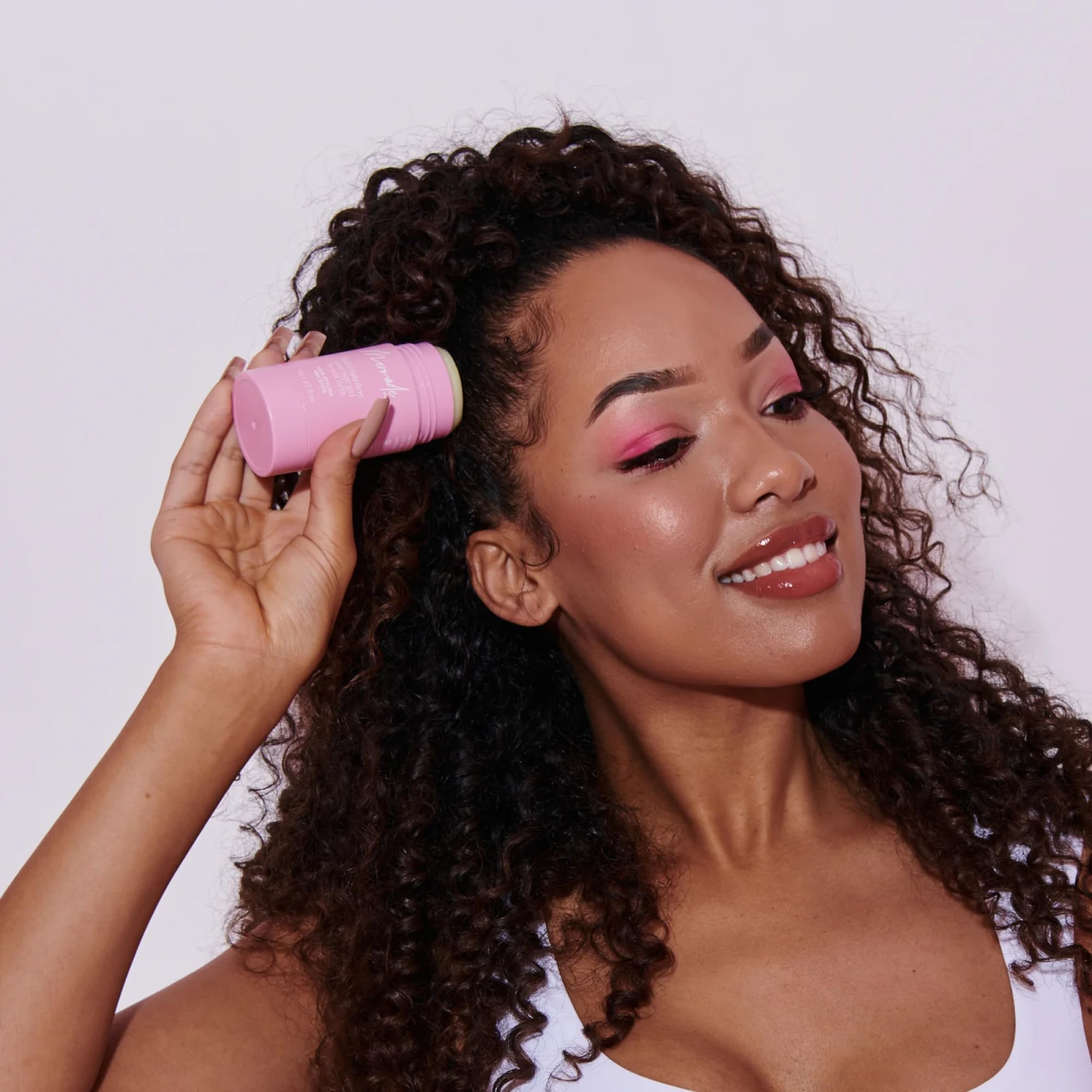 Mermade Hair Wax Stick pink beeswax texture adds subtle shine and definition.