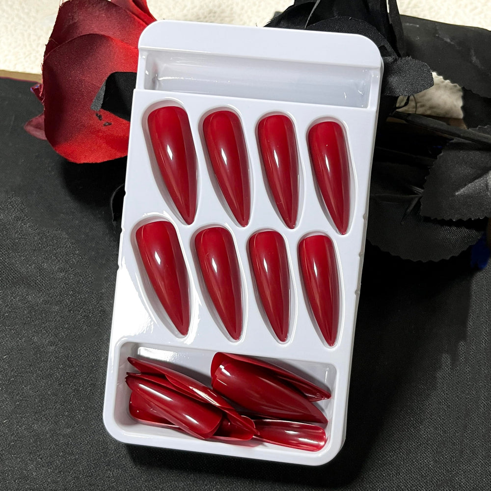 MERVF red acrylic press-on nails in stiletto shape for dramatic styling