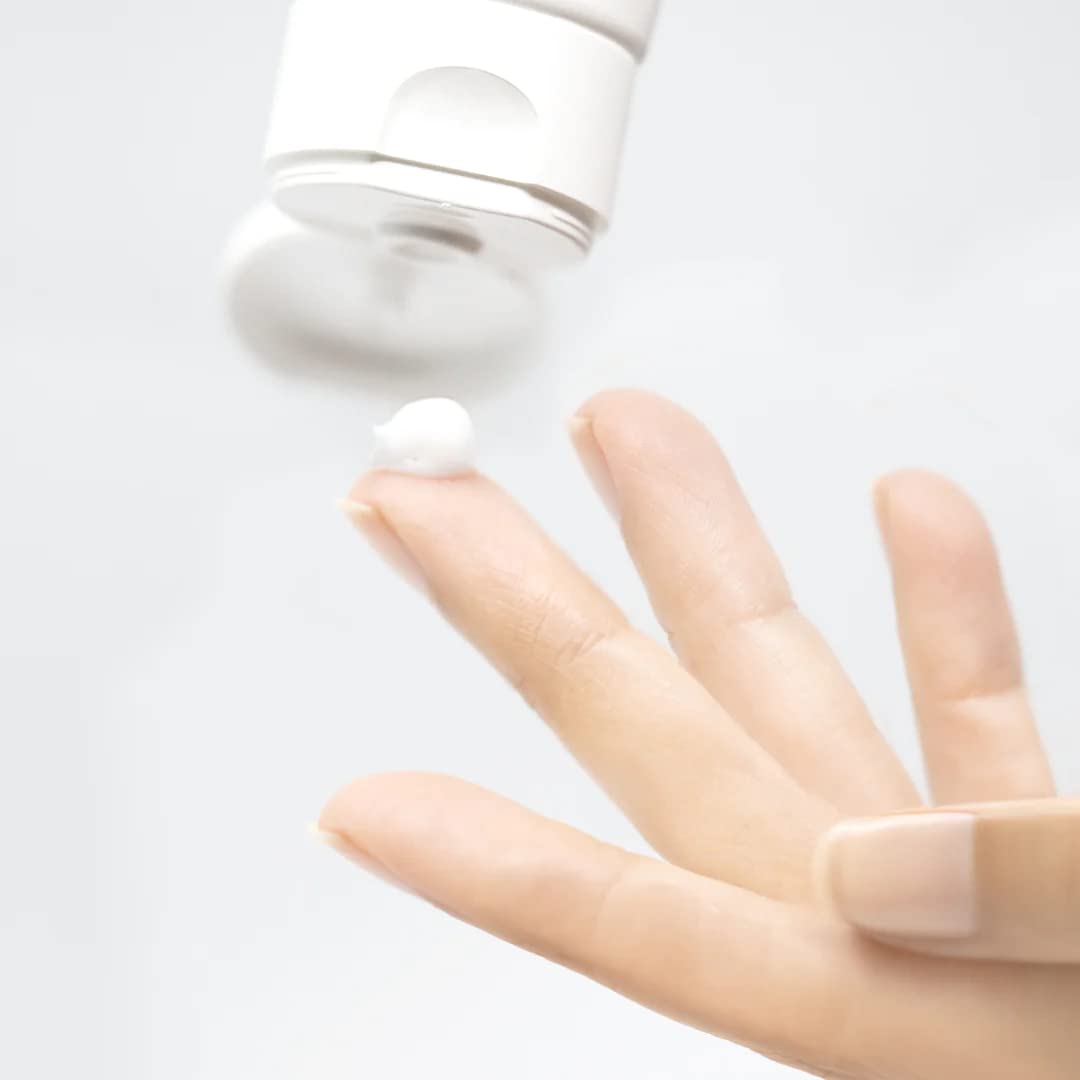Mesoestetic Brightening Foam foam applied on skin demonstrates gentle cleansing.