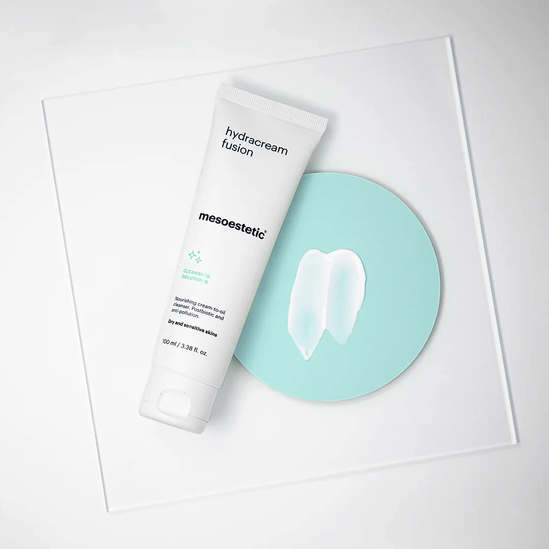 Mesoestetic Brightening Foam cleansing action shown removing makeup residue and impurities from skin.