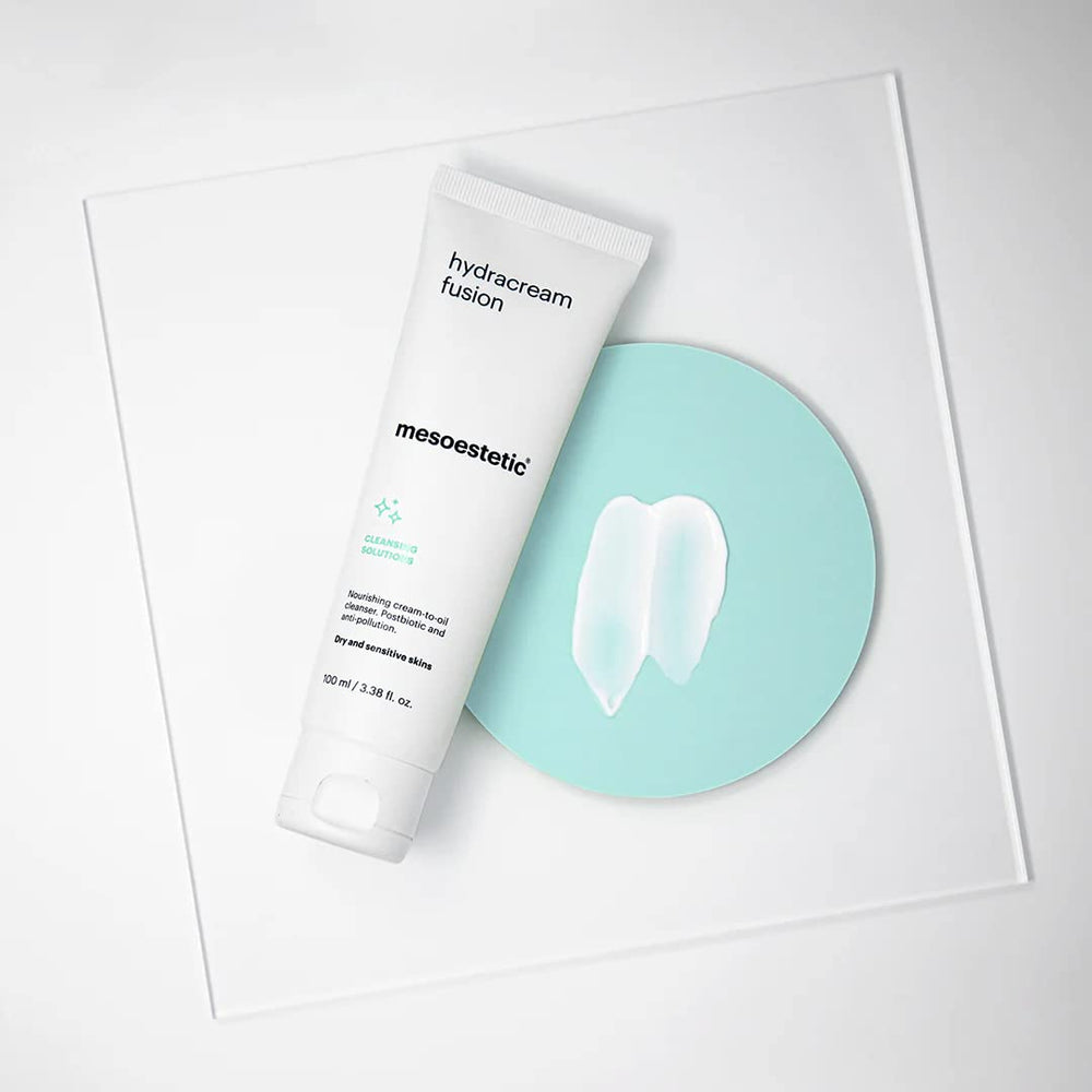 Mesoestetic Brightening Foam cleansing action shown removing makeup residue and impurities from skin.