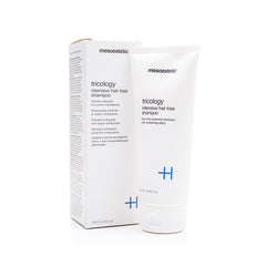 Mesoestetic Tricology shampoo label close-up, signals professional-grade thinning-hair formula.