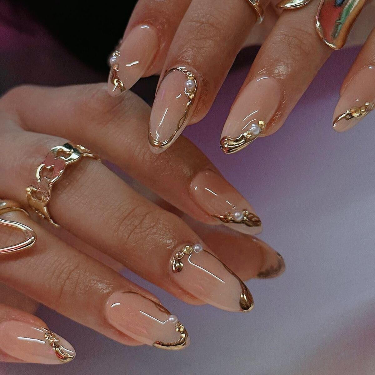 Meticula gold press-on nails almond French tip with 3D pearls for salon-quality results at home.