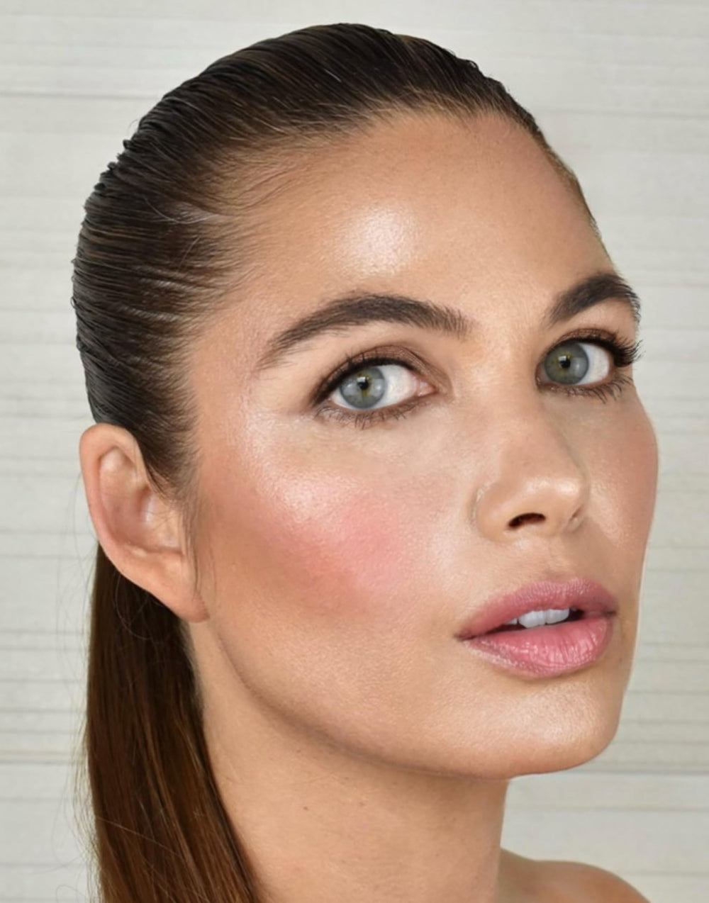 Cheek application swatch showing translucent tint for natural flush.
