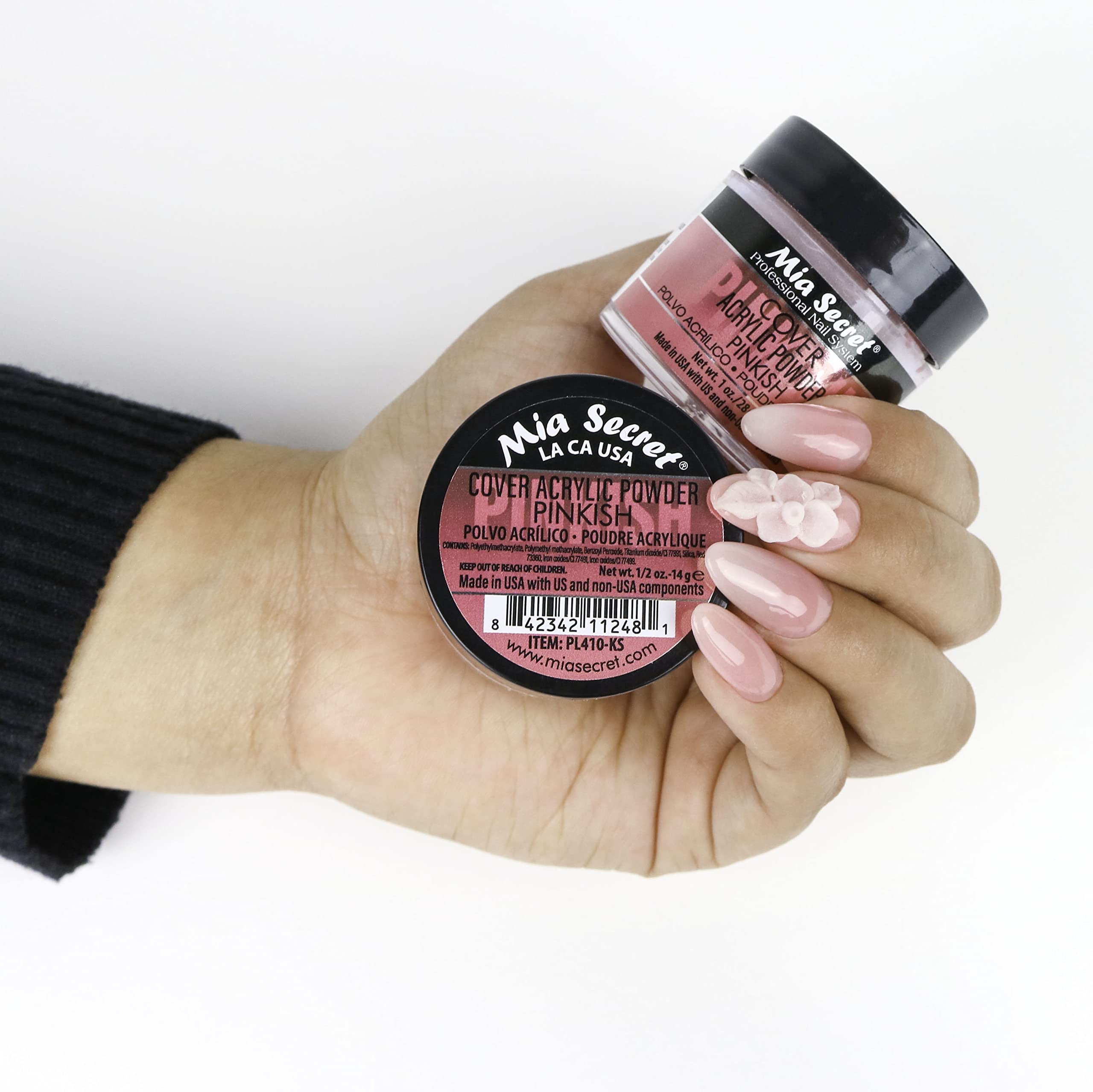 Pouring Mia Secret Cover Pinkish powder to show texture and consistency