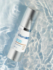 Hand applying MiamiMD Dark Glow Renewal Serum for multi-area coverage.