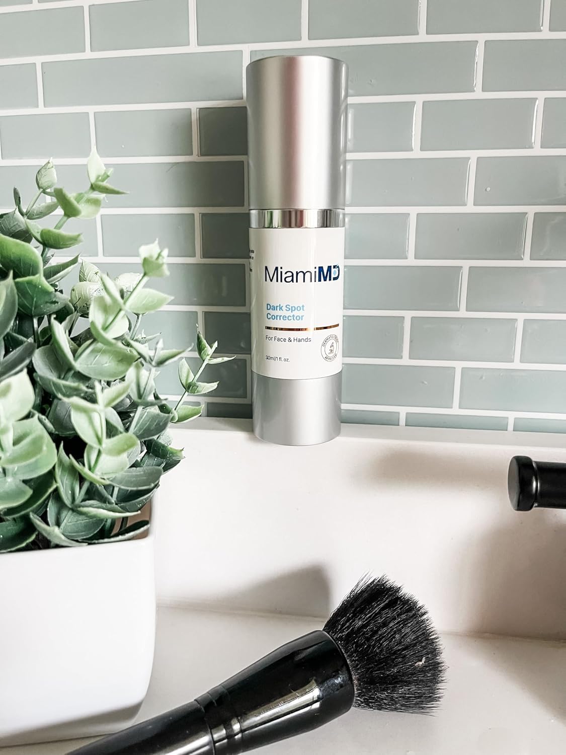 Ingredients like Alpha-Arbutin and Vitamin C shown on MiamiMD serum ingredients panel.