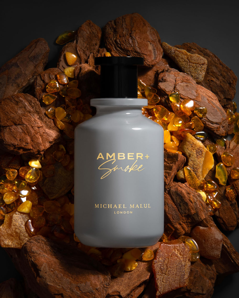 Amber + Smoke mid-notes highlight jasmine and amber resins, elevating sophistication.