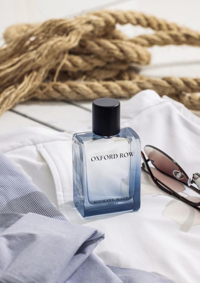Michael Malul Oxford Row bottle on wood evokes coastal elegance and confidence.