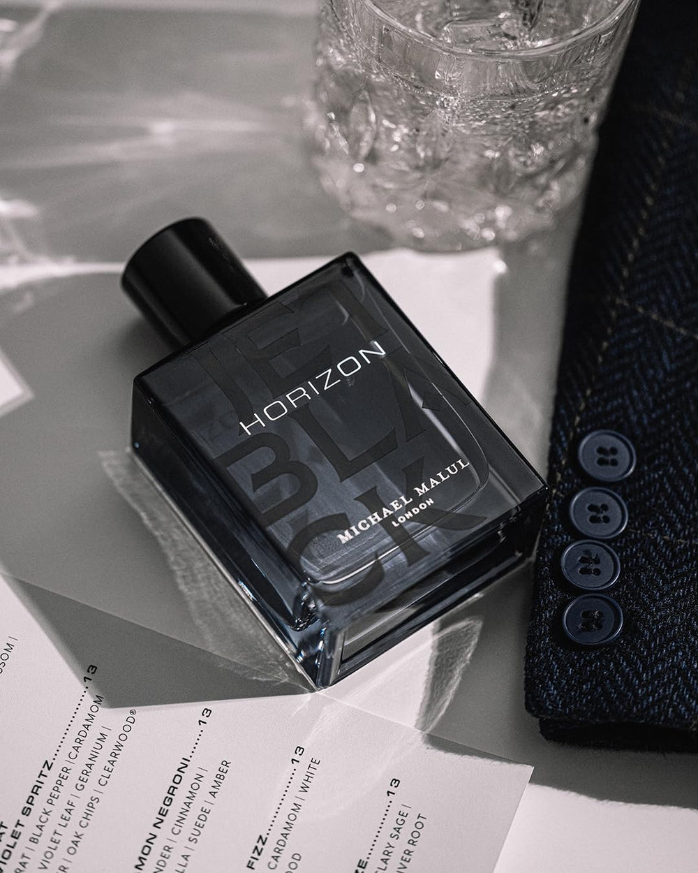 Michael Malul Jet Black Horizon packaging detail, embossed branding texture