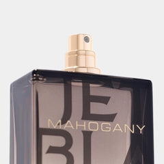 Jet Black Mahogany bottle close-up highlighting its dark refined finish