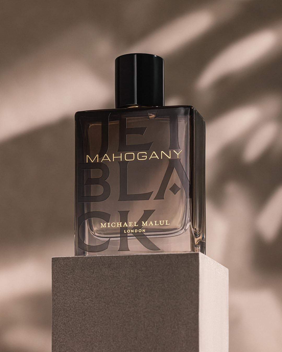 Bottle with outer box placement suggesting gifting and travel-ready setup