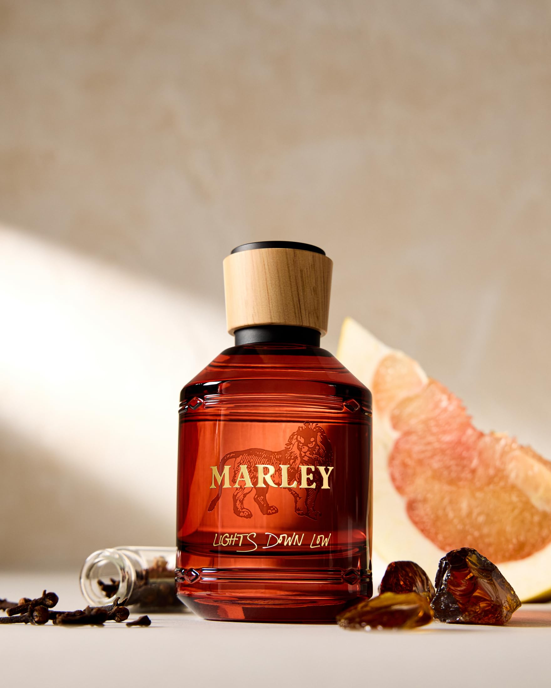 Michael Malul Lights Down Low warm base with sandalwood and amber for cozy evenings.