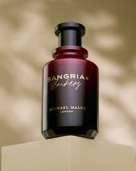 Michael Malul Sangria+Embers base-notes close-up featuring amber and sandalwood.