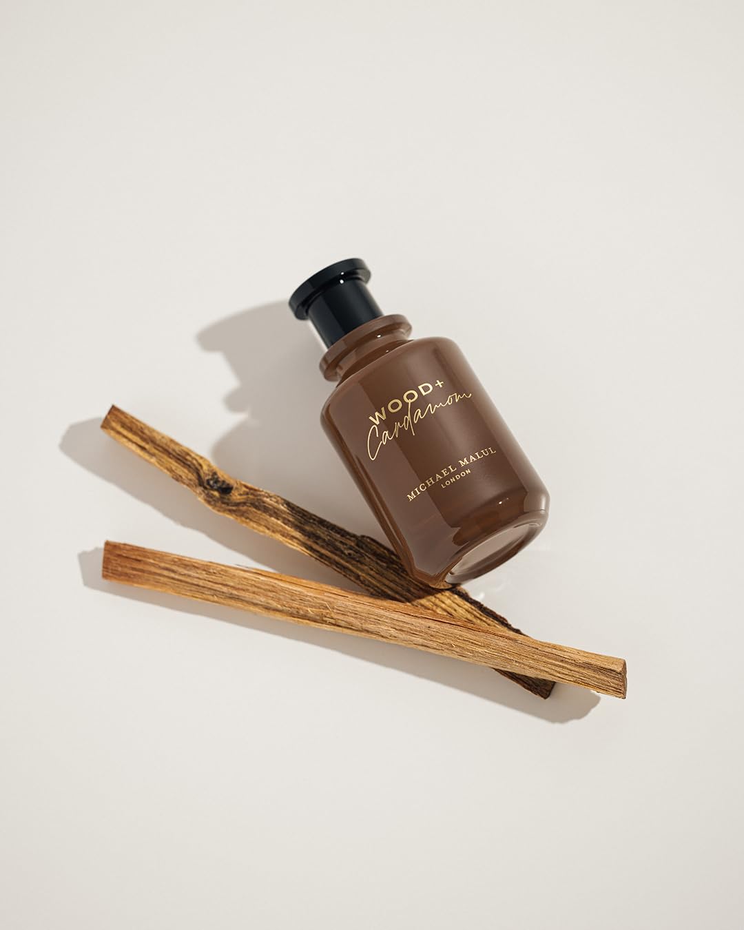 Bottle on wood surface for a warm, masculine vibe.