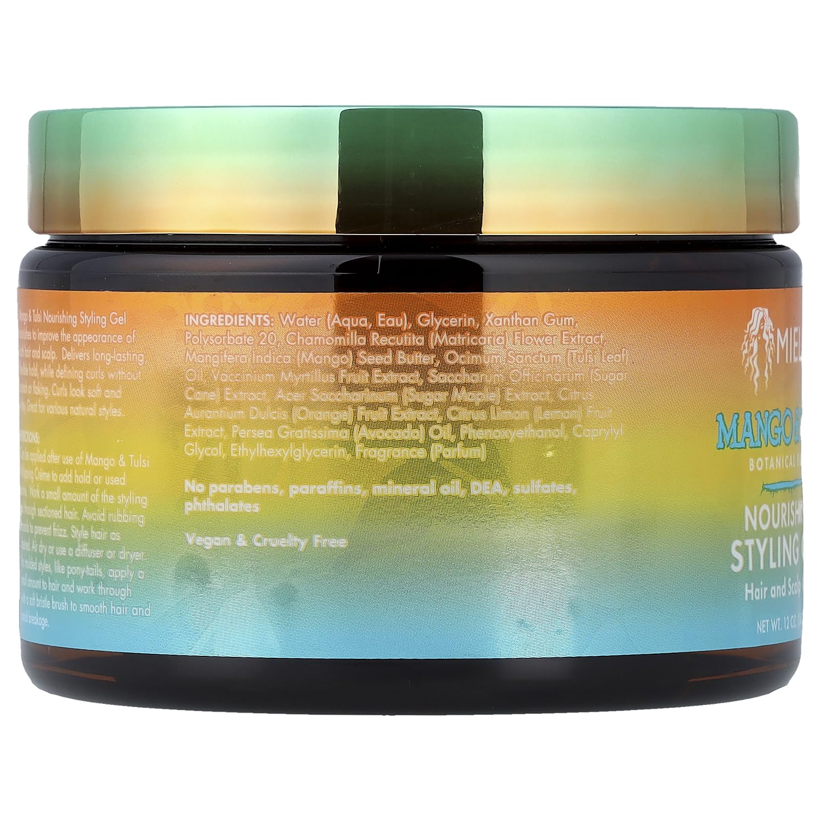 Hands applying Mielle Mango Tulsi gel for defined curls.