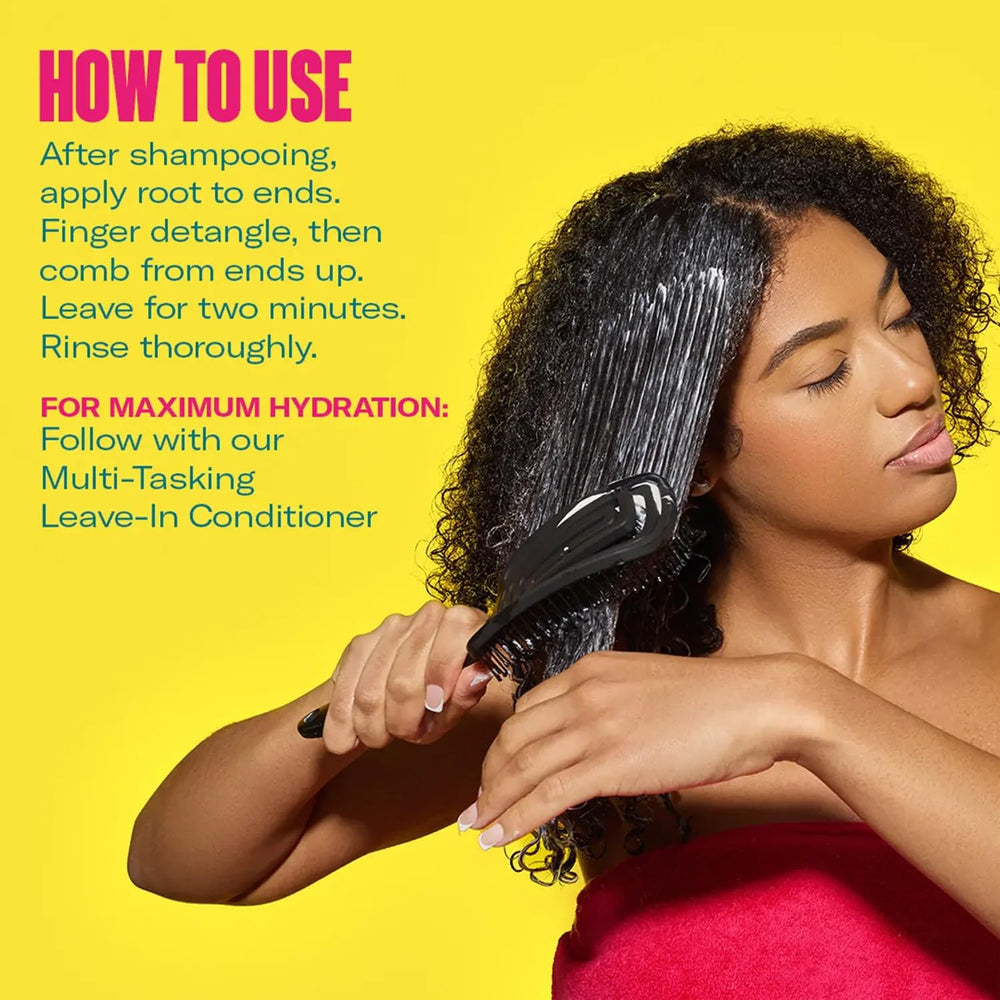 Mielle Organics 2-Minute Deep Conditioner swirls indicate rich moisture and texture.
