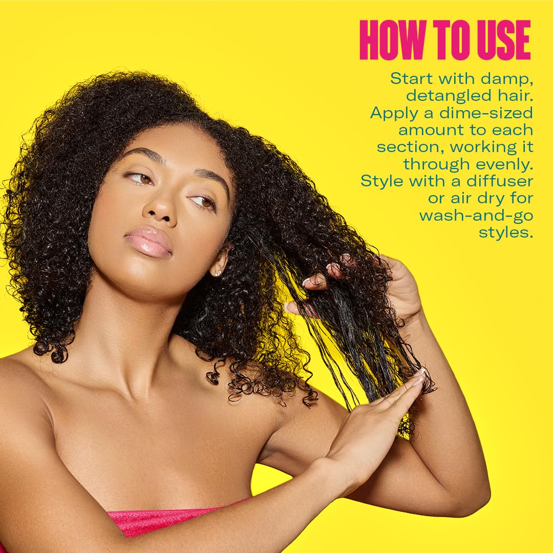 Mielle Organics Curl Forming Glaze applied to damp hair for even distribution.