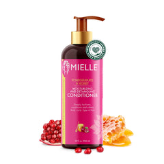 Mielle Organics Pomegranate & Honey detangling conditioner bottle provides hydrated curls.