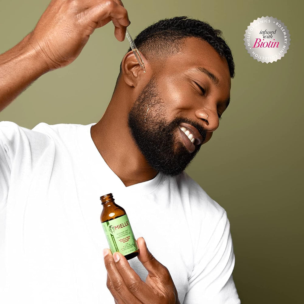 Product packaging of Mielle Organics Rosemary Mint Oil designed for home use