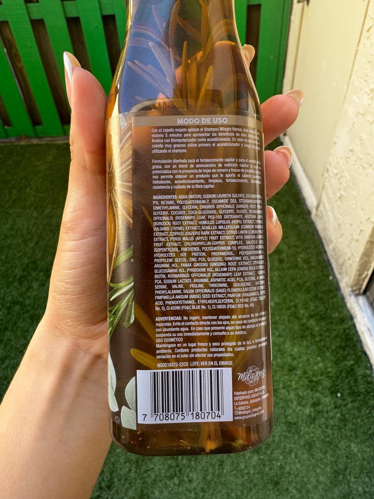 MILAGROS Rosemary Shampoo packaging rests on a clean bathroom shelf.