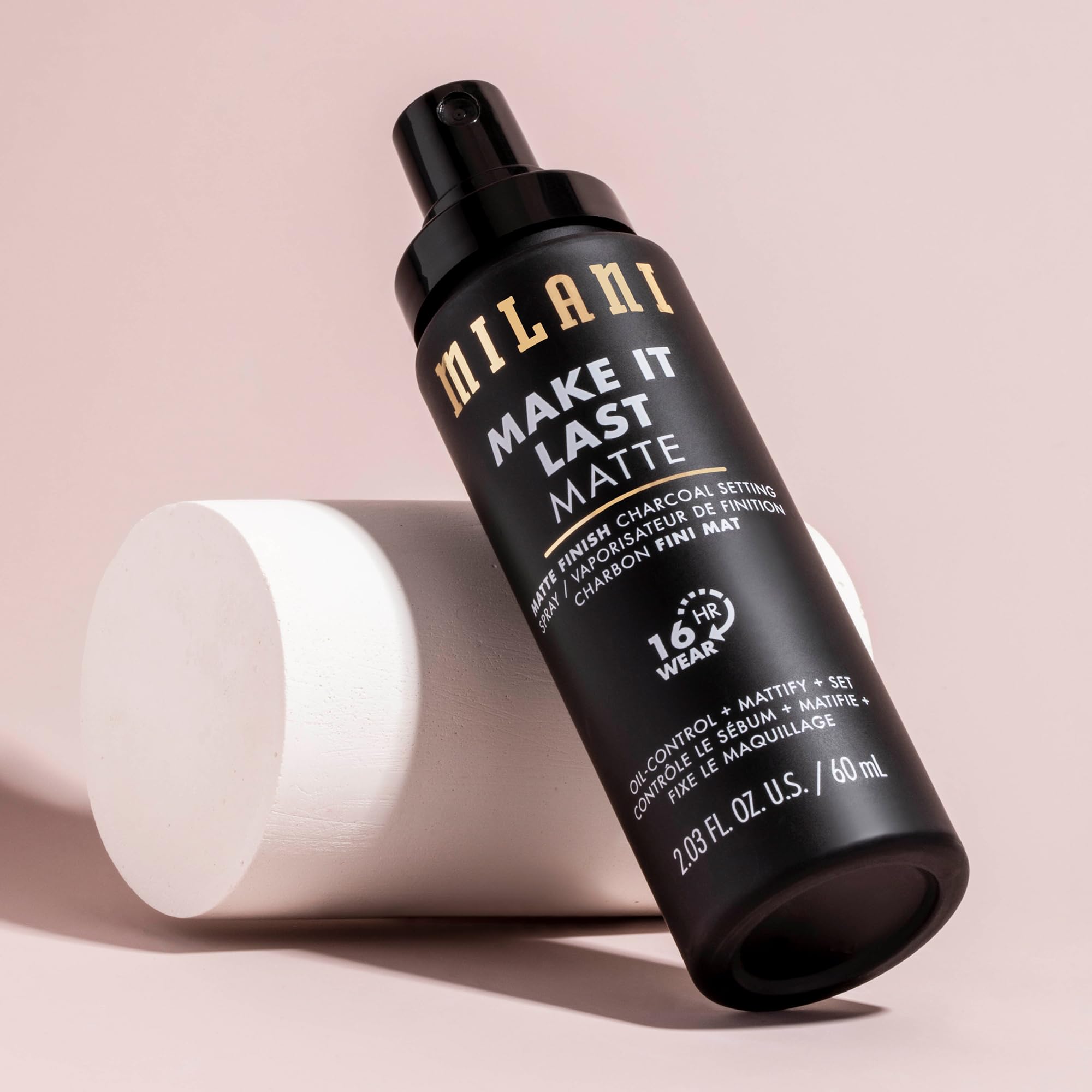 Milani charcoal powder detail showing mattifying texture on skin.