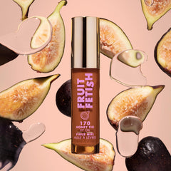 Honey Fig lip oil swatch on lips reveals a sheer glossy finish
