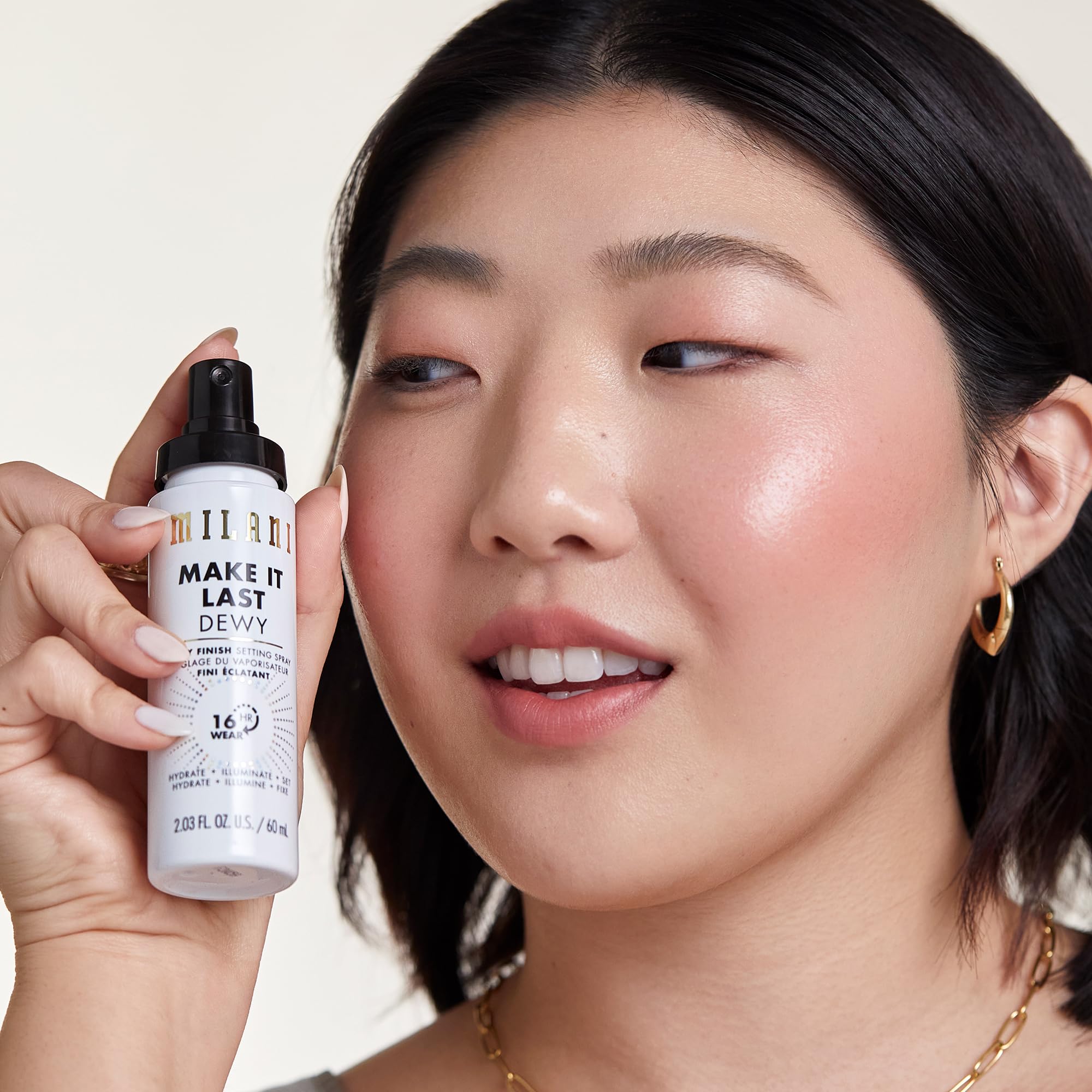 Milani Make It Dewy spray on the face delivering dewy radiance.