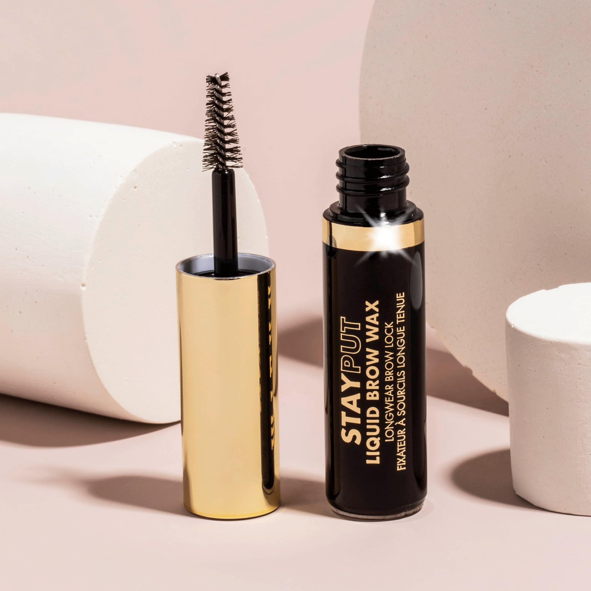 Milani Stay Put Brow Wax creates natural fullness with feathered, soft strokes.