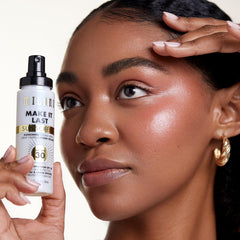 Milani Sunscreen Setting Spray face UV protection shields skin.