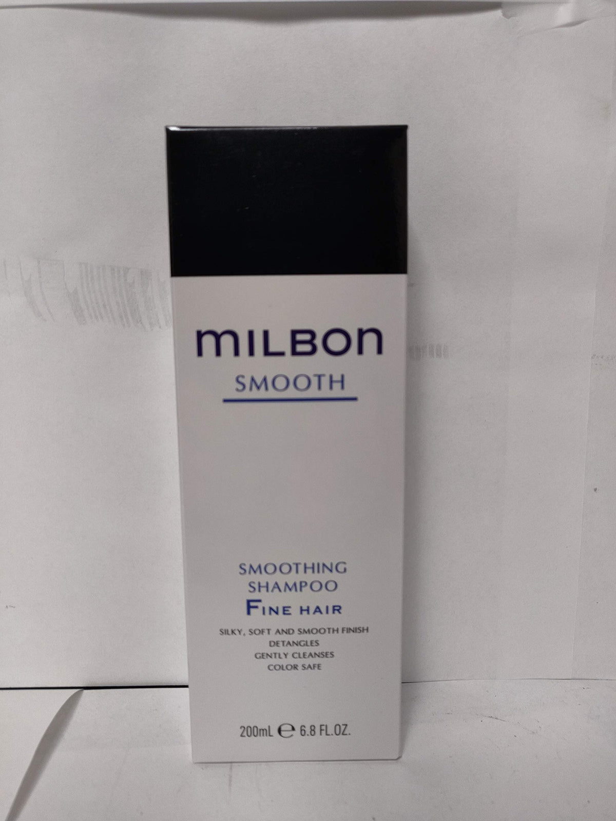 Milbon Smooth Smoothing Shampoo for fine hair bottle delivers silky, detangled strands for daily styling.