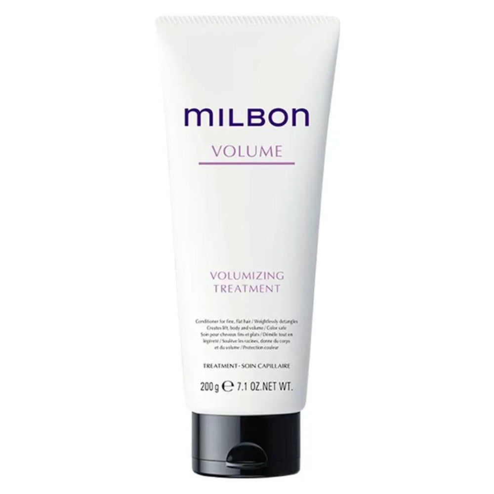 Milbon Volumizing Treatment Conditioner being worked through hair enhances softness and bounce.