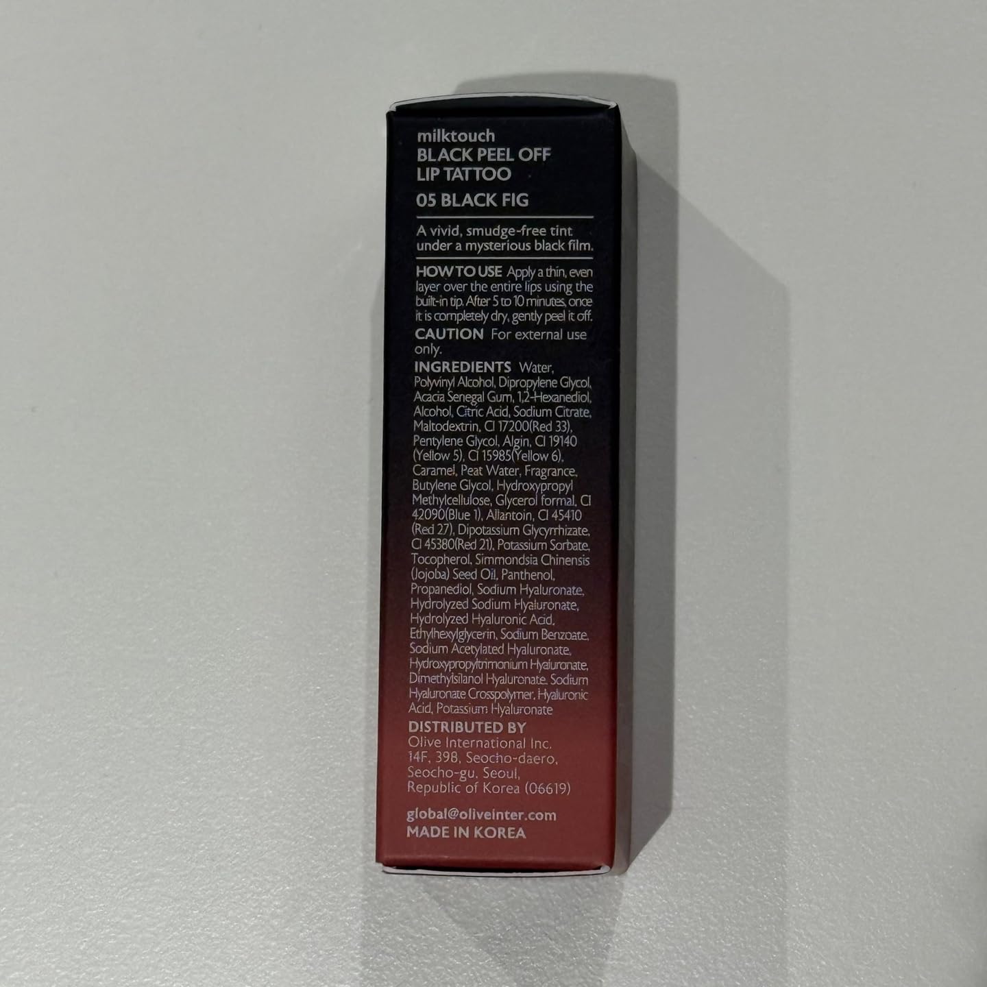 MilkTouch Black Peel Off Lip Tattoo packaging on display emphasizing premium design.