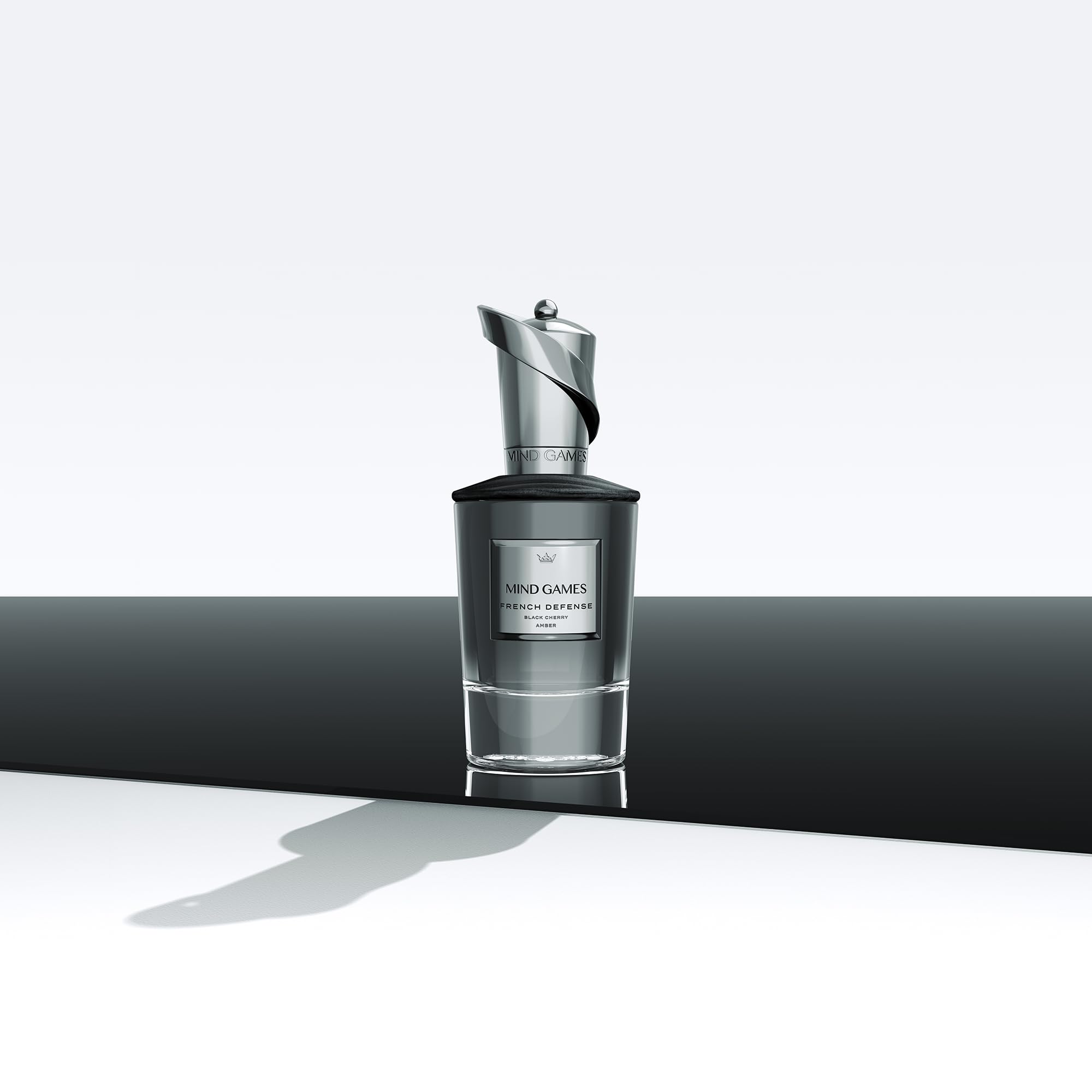 MIND GAMES French Defense bottle pour showing elegant vessel and fragrance reveal.