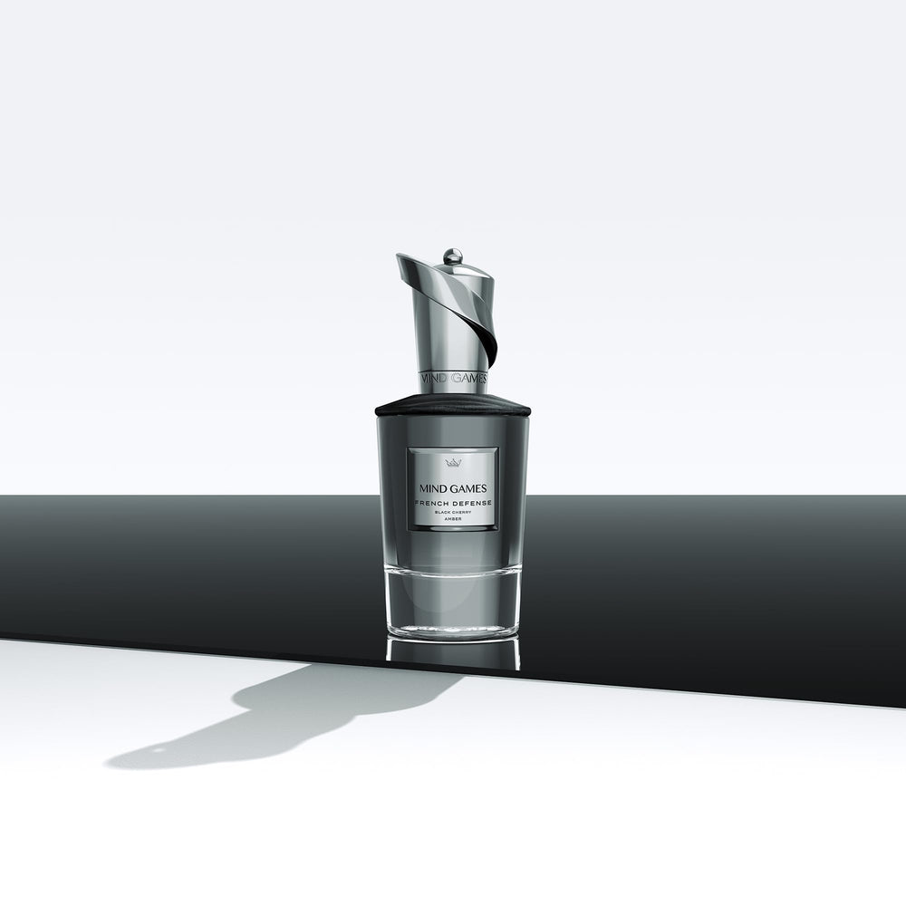 MIND GAMES French Defense bottle pour showing elegant vessel and fragrance reveal.