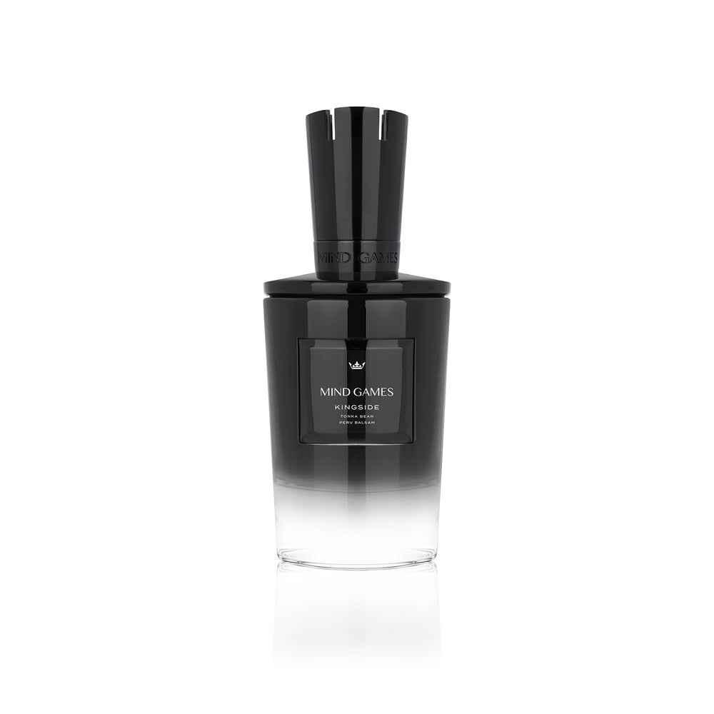 MIND GAMES Kingside bottle pour showing refined amber woody allure for evening wear.