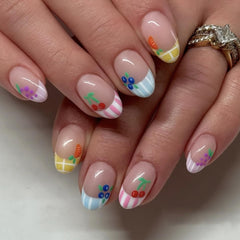 Mivota fruit press-on nails with nude short oval shape and pastel stripes for everyday chic