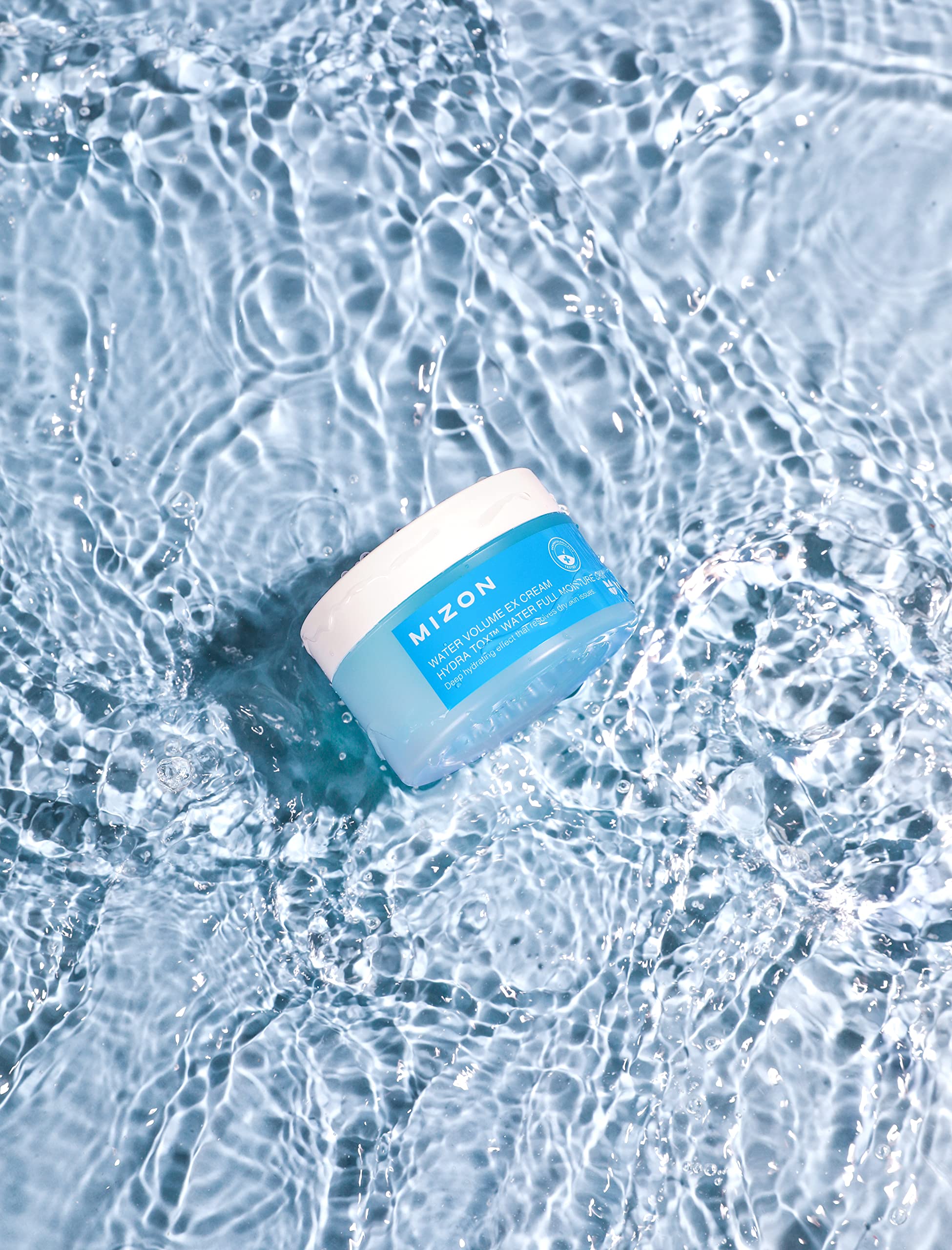 MIZON Water Volume EX Cream application rub demonstrates moisture release during massage.