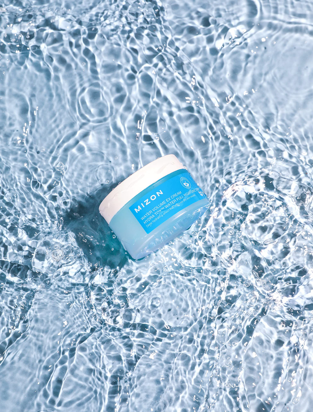 MIZON Water Volume EX Cream application rub demonstrates moisture release during massage.