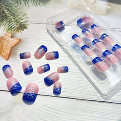 Snowflake accent nails in glossy blue by Mkwntg for holiday charm.