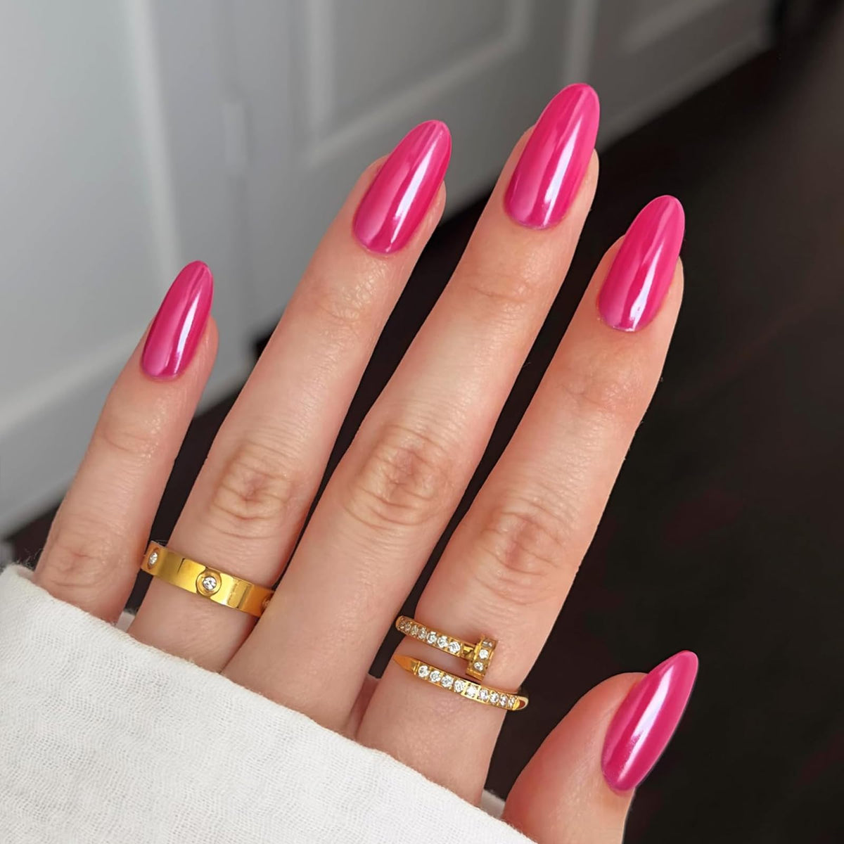 Modelones hot pink press-on nails almond for an effortless at-home manicure.