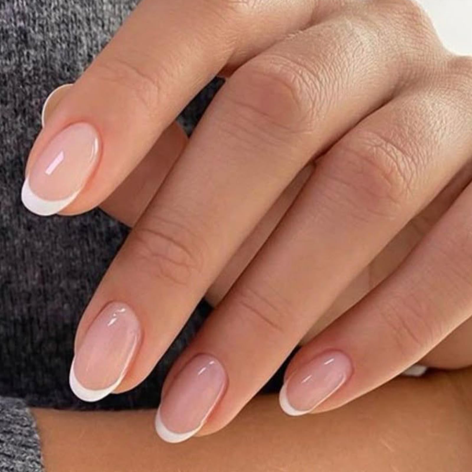 Modelones nude short oval press-on nails in a 32-piece set for versatile manicures