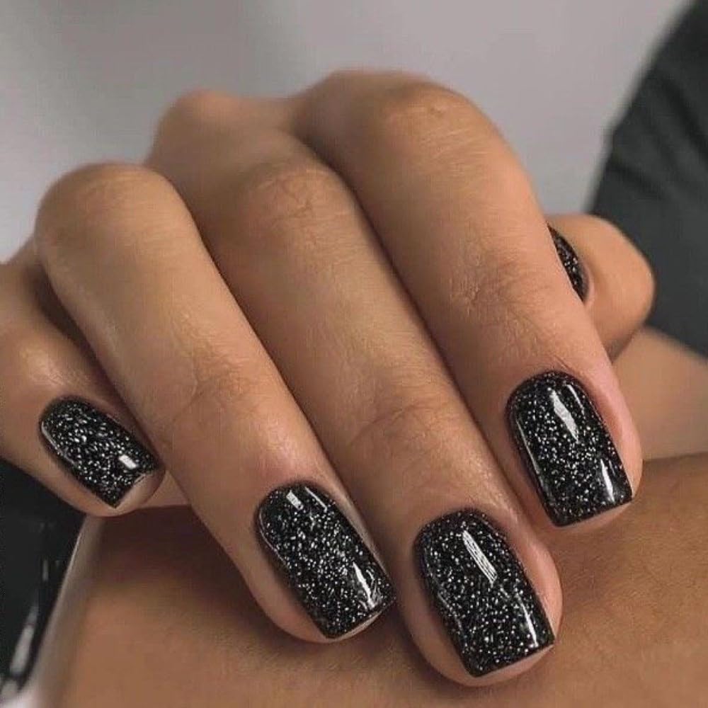 Modelones Sparkle Black nails shown with glue for fast DIY glam.