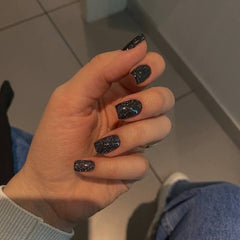 Modelones glittery black finish nails ideal for everyday wear and style.